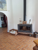 wood stove between dinner room and tower